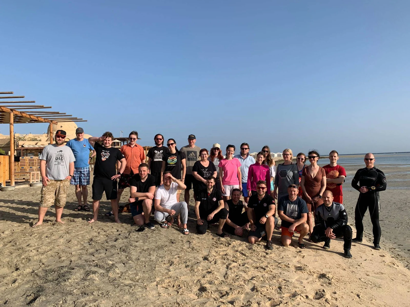 A group photo from a Divers expedition on the beach