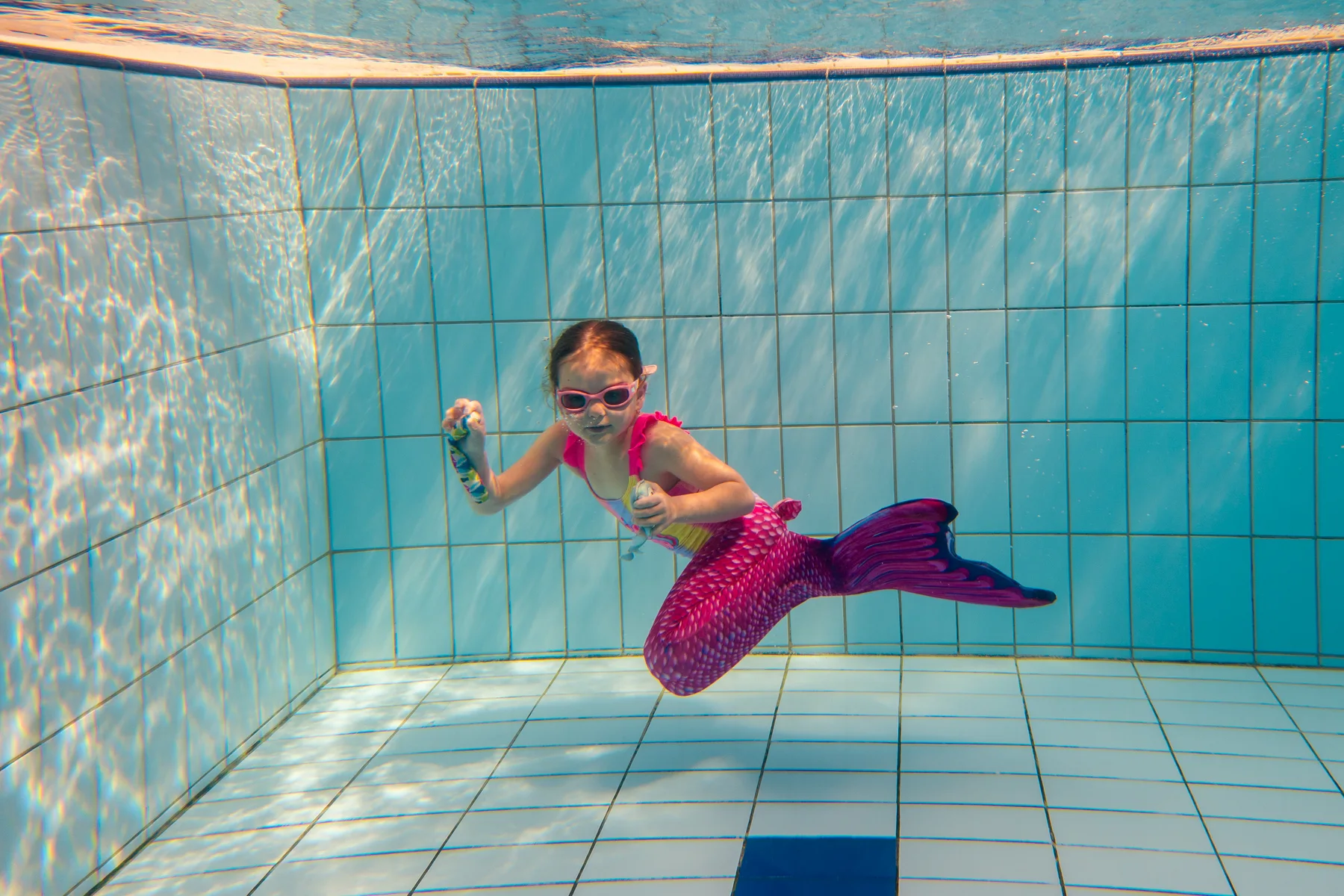 Mermaiding with a monofin beneath the surface