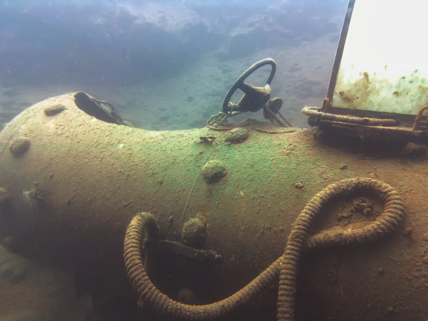 Underwater photograph of the Stejskanik submarine with a steering wheel