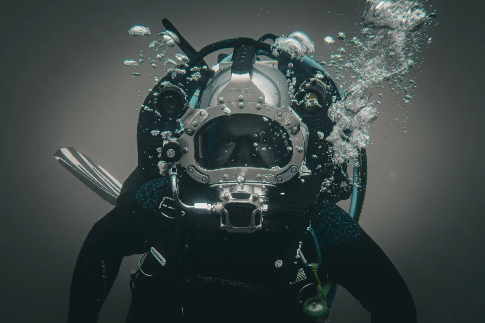 Diver with a Kirby Morgan helmet underwater