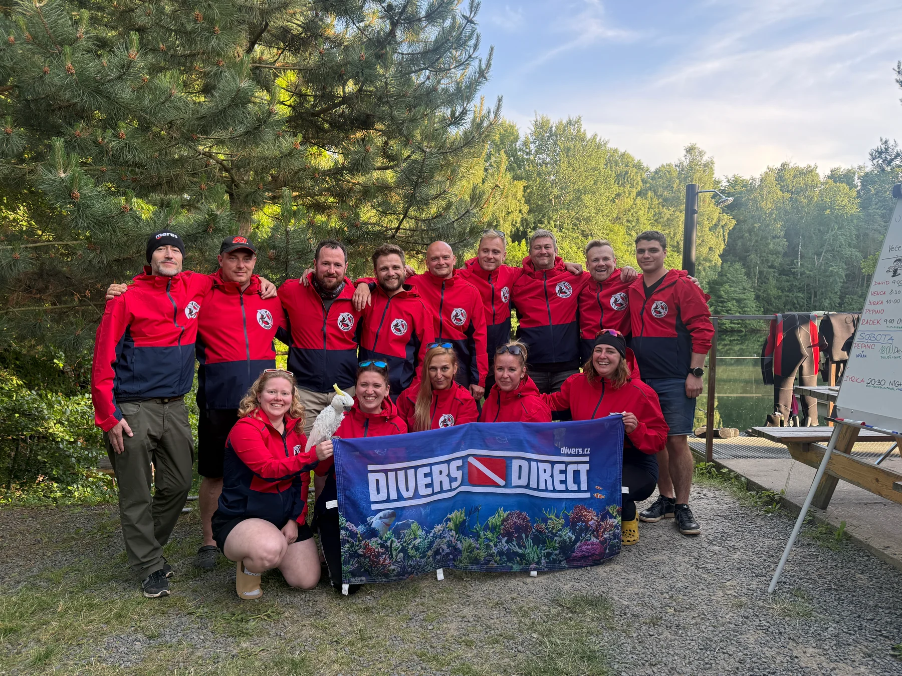 Divers team together by the water