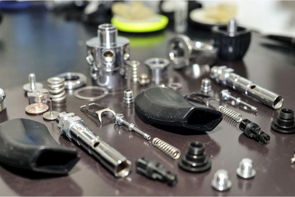Dismantled dive regulator and its components on the service table